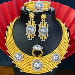 Elegant selection of special gifts including jewelry, keepsakes, and artisanal home décor arranged with delicate wrapping